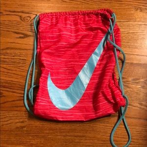 Hot pink and turquoise Nike drawstring backpack